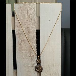 Gold drop modern necklace with yellow stones